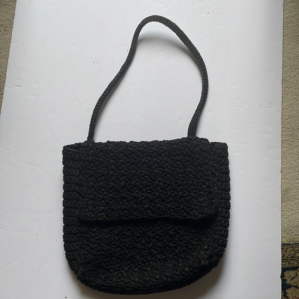 Carrie Forbes, New York designer in the 80’s. Black bag, 11” tall x 13” wide.